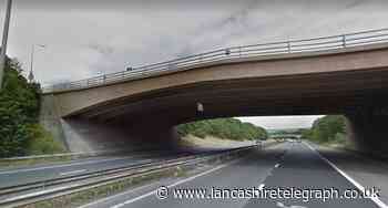 Motorway bridge ravers threw items at officers before running across M65