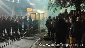 Angry students pull down security fences erected around halls of residence