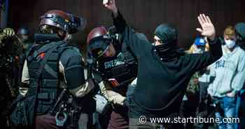 Election protesters shined laser in officer's eyes, kicked another in groin, charges say