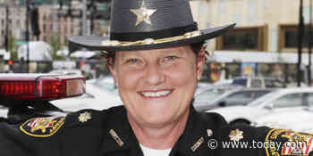 She says the sheriff fired her for being gay. Now, she'll be the sheriff