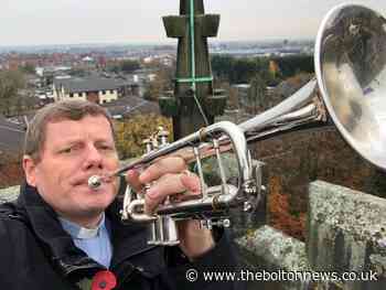Vicar climbs tower to play Last Post at remembrance service