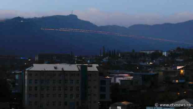 Azerbaijani leader says forces have seized key city, Armenians deny the claim