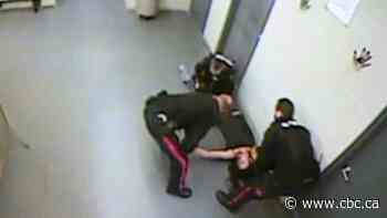 Video showing woman knocked out, dragged to RCMP cell prompts lawsuit, call for investigation