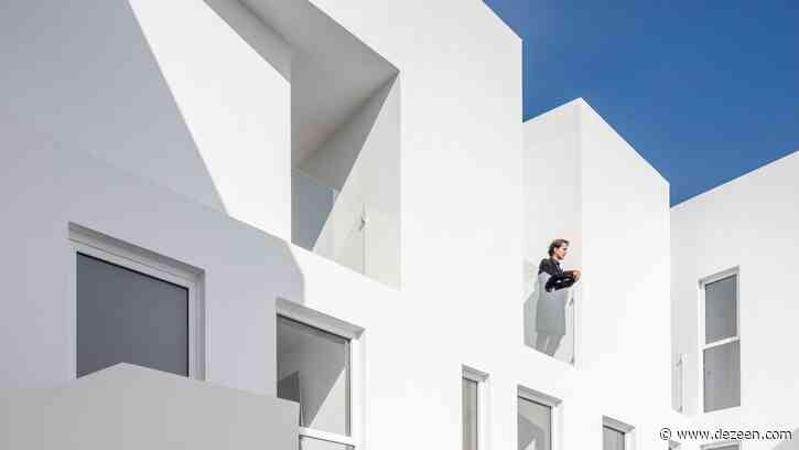 Bright white walls contrast historic facade of MM34 apartments in Mexico City