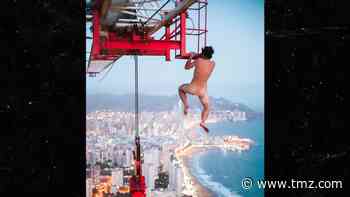 Daredevil Hangs Naked from 660-ft Crane with No Rope
