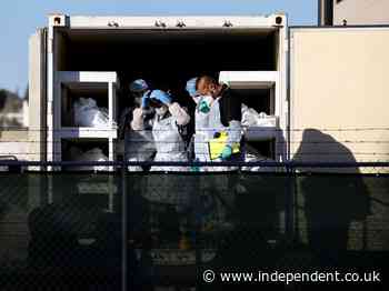 Inmates paid $2 to ‘move deceased Covid patients to mobile overflow morgues’ as infections soar