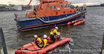 Two adults and two children rescued after being cut off by rising tide