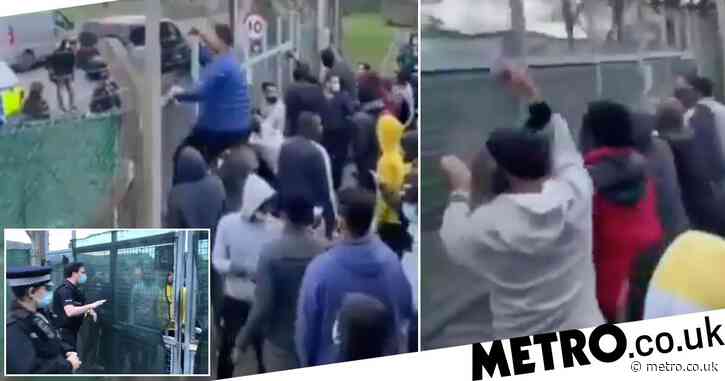 Migrants protest over conditions at barracks where they are being housed