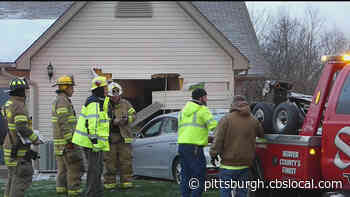 Woman Briefly Trapped After Car Crashes Into Her Home