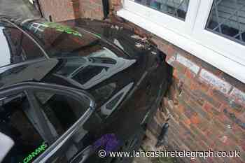 Shocking moment Range Rover reverses into car smashing it through front of Blackburn house