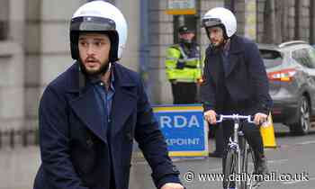 Kit Harington looks dapper as he rides a bike on set of Modern Love's second season