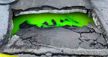 Sinkhole filled with glowing green liquid found in middle of Toronto street - blogTO