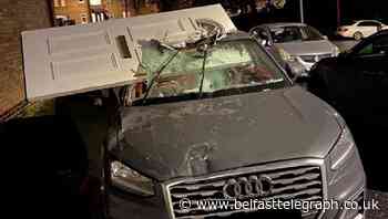 Car driven away with front door lodged in windscreen after crashing into house
