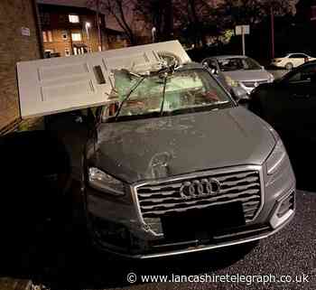 Motorist continued to drive with front door lodged in windscreen