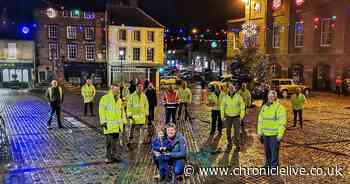 'We may be down but the lights aren't out': Xmas lights switched on in secret