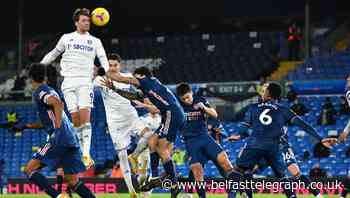 Goal frame denies Leeds three times as 10-man Arsenal hold on for a point