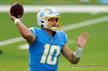 The Latest: Chargers QB Herbert Rolling Vs. Jets