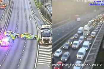 M1 Hertfordshire and London closed after man falls - live