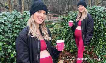 Helen Flanagan highlights her baby bump in a sporty crop top for a walk in the woods