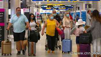 Americans continue holiday travel despite case surge