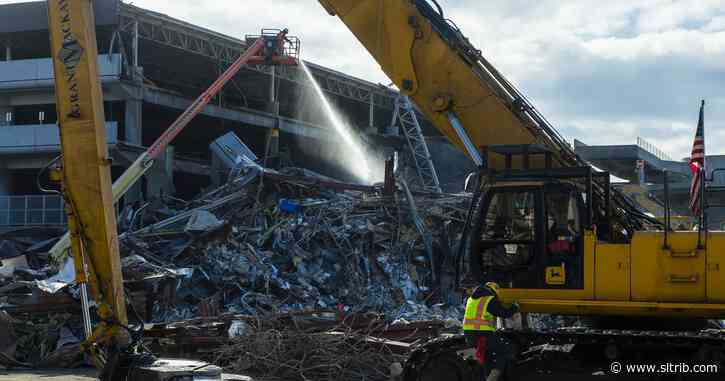 Crews are razing parts of the old Salt Lake City International Airport to make way for the new