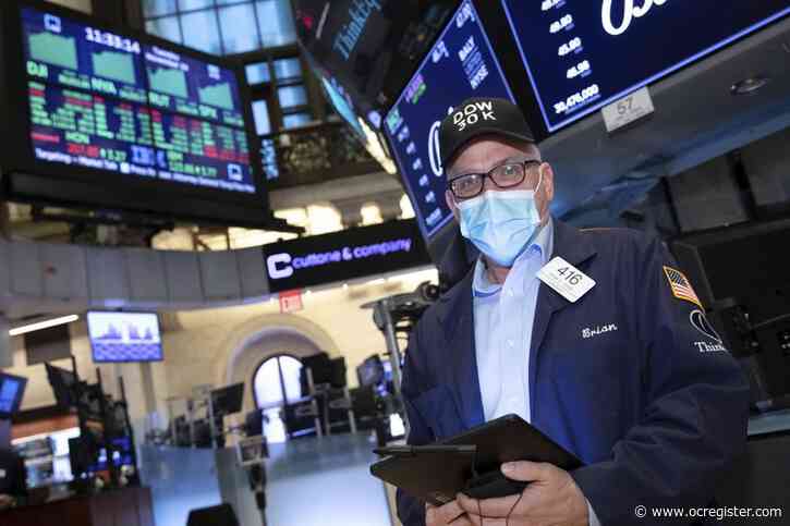 Dow crests 30,000 points on vaccine hopes, Biden transition