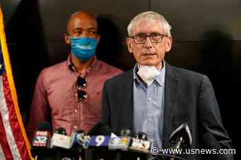 Evers Says Skip Holiday Parties as State Sets Virus Record