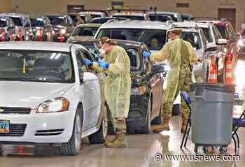 The Latest: Indiana Nears Its Monthly Virus Death Record
