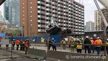 Crews work to recover crane that toppled over at Toronto construction site - CTV Toronto