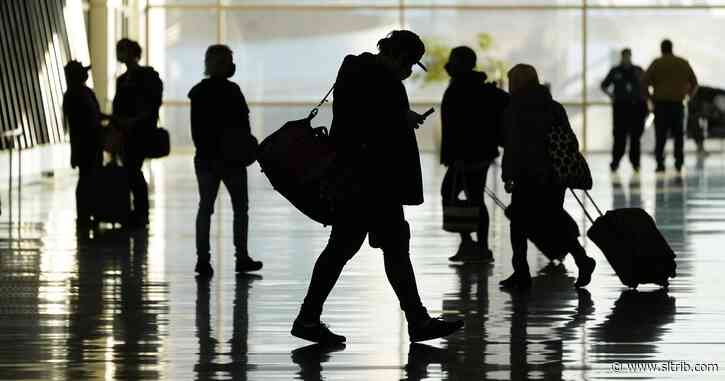 Thanksgiving crowds at Salt Lake City International Airport are smaller as experts urge people to stay home