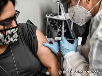 Coronavirus live updates: Vaccines to roll out for priority groups in early 2021, feds say
