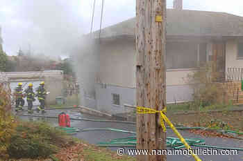 Crews putting out fire in a house on Wakesiah Avenue in Nanaimo