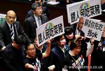 Pig guts fly in Taiwan parliament protest