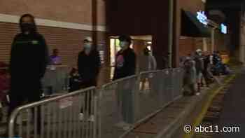 Masked up Black Friday shoppers form socially distant lines outside NC stores