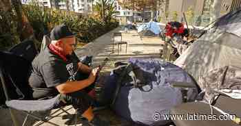 Homeless struggle as COVID-19 closes more indoor spaces - Los Angeles Times
