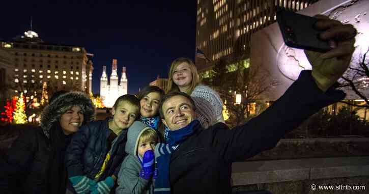 Temple Square holiday lights draw a small but cheerful crowd