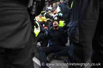 Dozens arrested as lockdown protesters clash with police