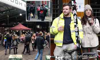 Drinkers enjoy a tipple in London's bustling Borough Market ahead of new Tier 2 lockdown rules