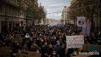 Clashes in Paris as thousands protest bill that would outlaw filming police officers