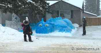 Huge blue snow dragon providing photo-op joy to Saskatoon residents