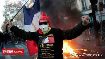 France: Tear gas fired as protesters rally against police security bill