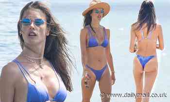 Alessandra Ambrosio prances around the beach in a skimpy purple bikini while vacationing in Brazil