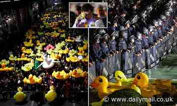 Thousands of Thai pro-democracy protesters march on royal barracks wielding rubber ducks
