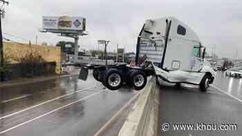 Big rig seen hanging off of Southwest Freeway during rainy Saturday in Houston - KHOU.com