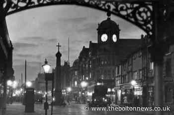 Dusk falls on Preston's the Jewellers and Bolton town centre