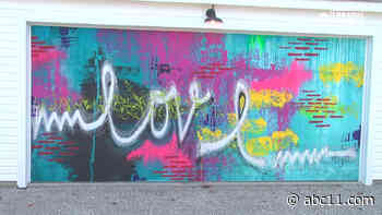 Chicago alley lined with bright murals on West Side