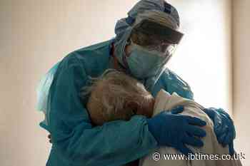 Photo of Texas doctor comforting elderly Covid patient goes viral