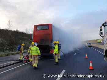 Fire crews battle blaze as double-decker bus bursts into flames during rush hour