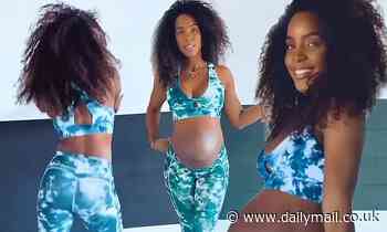 Kelly Rowland proudly flaunts her third-trimester baby bump in ocean-hued sports bra and leggings