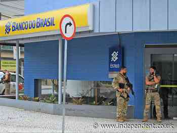 Bank robbers take over entire Brazilian city and leave locals to pick up cash left on streets